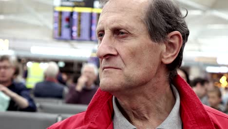 Pensive-sad-old-man-in--the-airport's-waiting-room