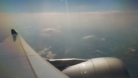 sunny-day-flying-airplane-engine-passenger-window-view-panorama-4k-china