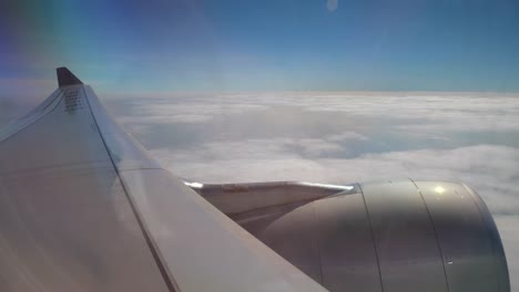 sunny-day-flying-airplane-wing-passenger-window-view-panorama-4k-china