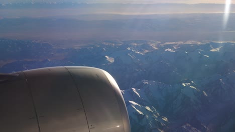 sunny-day-flying-airplane-engine-passenger-window-view-panorama-4k-china