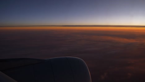 puesta-de-sol-cielo-avión-asiento-de-ventana-en-china-motor-4k