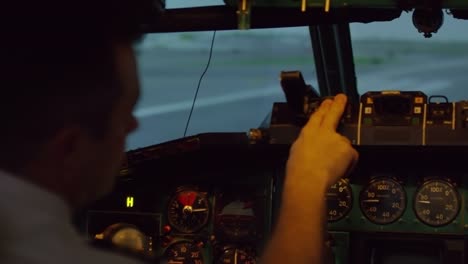 Pilot-Checking-Flight-Instruments-in-Cockpit