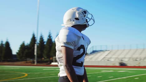 The-camera-spins-around-a-football-player-on-the-field-right-before-a-game