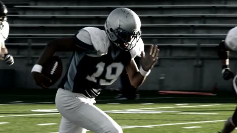 Football-player-sprints-down-the-field-with-the-ball-and-scores