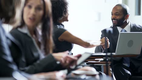 Caucasian-American-female-business-managers-in-airport-lounge