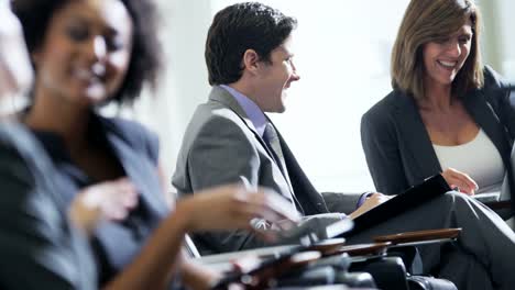 Caucasian-female-executive-meeting-with-colleague-in-airport