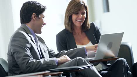 Caucasian-female-financial-advisor-meeting-colleague-in-airport