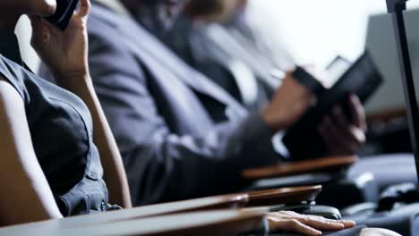 African-American-businesswoman-using-smartphone-in-airport-lounge