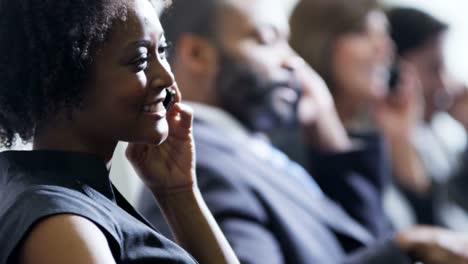 Ethnic-female-financial-consultant-using-technology-in-airport