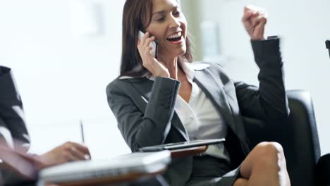 Caucasian-female-financial-consultant-using-smartphone-in-airport