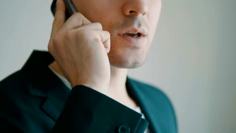 Businessman-walks-off-jet-talking-on-cell-phone