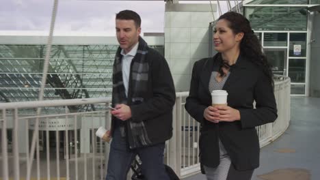 Business-people-walking-at-airport