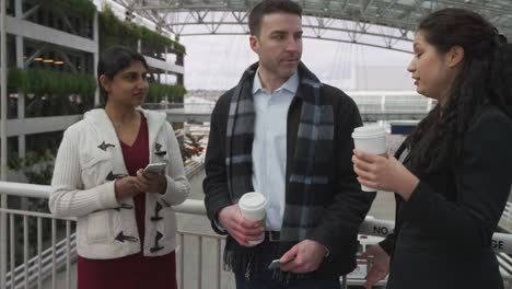 Group-of-business-people-meeting-and-talking-at-airport