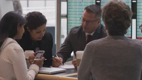 Group-of-businesspeople-meeting-at-airport