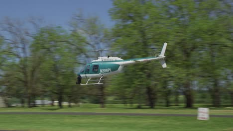 Helicopter-makes-low-altitude-pass-at-rural-airport.--Shot-with-RED-Epic.