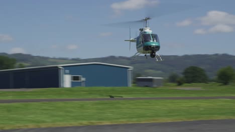 Helicopter-flying-sideways-at-rural-airport.--Shot-with-RED-Epic.