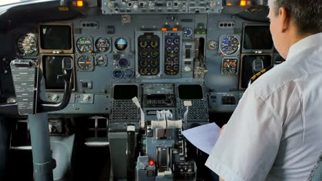 The-pilot-prepares-to-flight-and-checks-some-documents