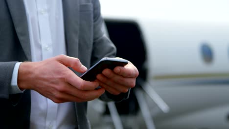 Businessman-using-mobile-phone-at-terminal-4k