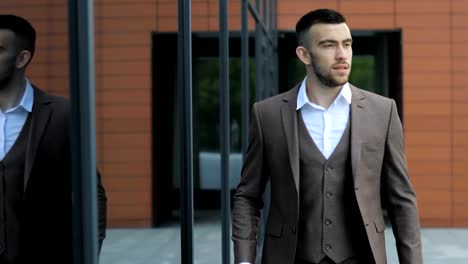 Businessman-with-a-briefcase-Walking-on-Streets-of-Business-District