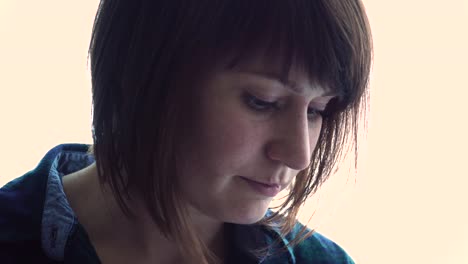 woman-in-airport-terminal-awaiting-flight-using-smartphone