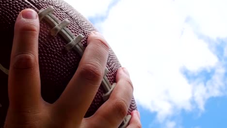 hands-catching-rugby,-football-ball,-slow-motion