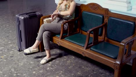 Beautiful-attractive-young-woman-at-the-airport.-Waiting