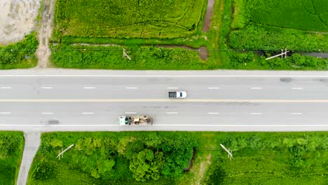 Drone-shot-high-angle-Aerial-view-of-highway-traffic-at-the-countryside,-The-car-truck-and-motorcycle-transport