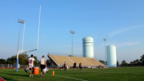 Player-Walking-on-a-Football-Field.