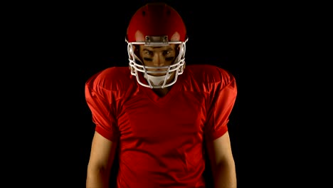 Red-serious-american-football-player-posing