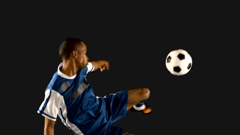 Football-player-kicking-the-ball