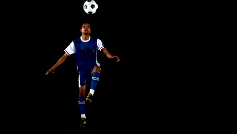 Handsome-man-juggling-a-football