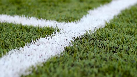 Close-up--of-the-out-of-bounds--line-on--a-turf-football-field