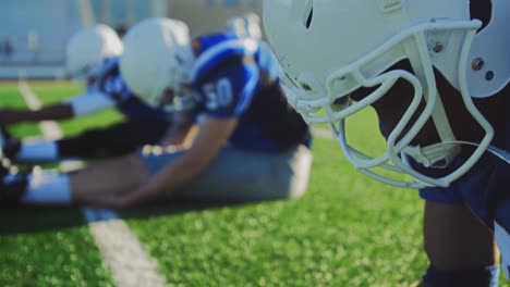 Football-players-stretching-before-a-game