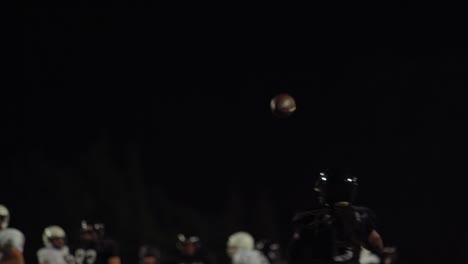 A-football-player-throws-the-ball-toward-the-camera-and-they-make-a-touchdown