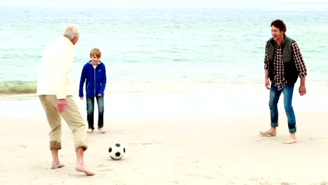 Family-playing-football-together