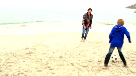 Father-and-son-playing-football