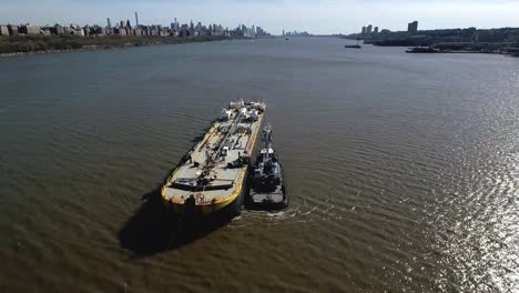 Fly-Backwards-Over-Oil-Tanker-Next-To-Tug-Boat-on-Hudson-River