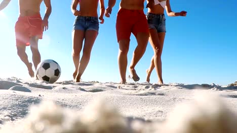 Group-of-friends-playing-football