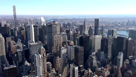 Panoramic-and-aerial-view-of-Manhattan-buildings-in-New-York-City,-NY,-USA.-New-york-city-skyline-aerial-view-at-sunset.-Urban-metropolis-landmark-scenery-background.