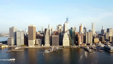 Aerial-view-of-Manhattan-district-in-New-York,-America.-Drone-flying-along-the-shore-of-East-river,-downtown-view