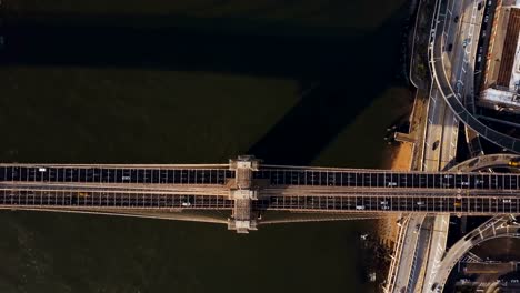 Aerial-view-of-Brooklyn-bridge-through-the-East-river-from-the-Manhattan-to-Brooklyn-in-New-York,-America