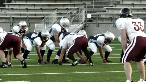 Football-player-throw-a-ball-to-another-who-catches-it