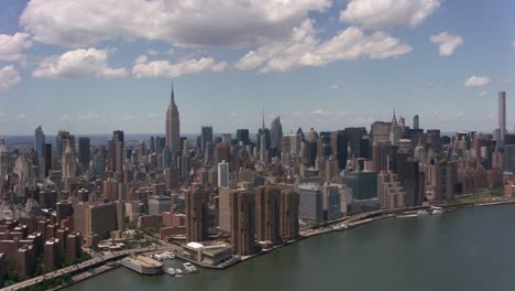 Aerial-shot-of-downtown-Manhattan-buildings-from-East-River.