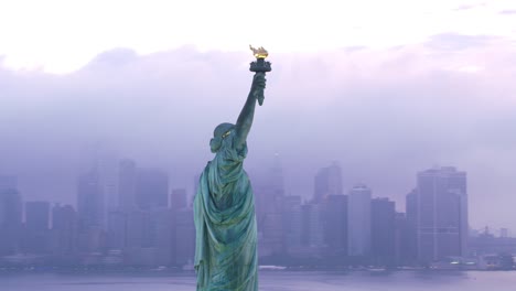 Aerial-orbit-of-Statue-of-Liberty-at-sunrise.