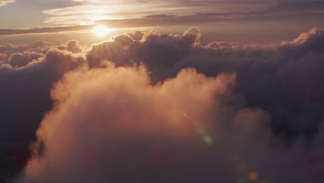 Aerial-view-of-sunrise-over-clouds-with-New-York-City-below.