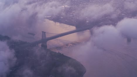 Looking-through-clouds-down-at-Williamsburg-Bridge.
