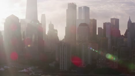 Tracking-by-lower-Manhattan-buildings-with-low-clouds-and-early-morning-sunshine.