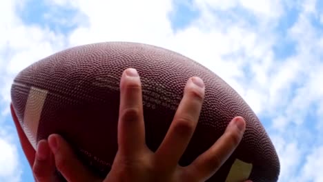 hands-catching-rugby,-football-ball,-slow-motion