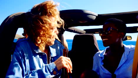 Female-friends-interacting-with-each-in-the-car-4k