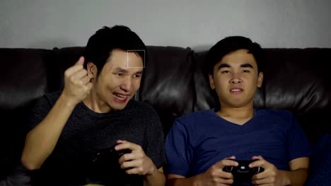 two-man-playing-video-games-and-wins